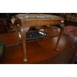 An early 20th Century dressing stool having cabriole legs