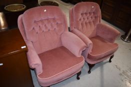 A pair of traditional button back armchairs upholstered in pink dralon in cabriole legs, very
