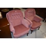 A pair of traditional button back armchairs upholstered in pink dralon in cabriole legs, very