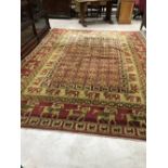 A traditional carpet square having animalistic decoration