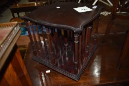 An early 20th Century mahogany table top revolving bookcase