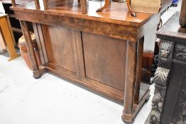 A Victorian mahogany sideboard/console having column supports and panel base