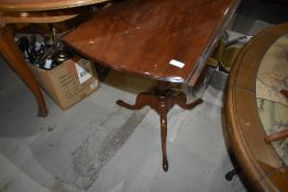 An interesting 19th Century and later pedestal table having turned column base on triple splay