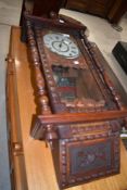 A 19th Century stained frame continental wall clock