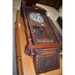 A 19th Century stained frame continental wall clock