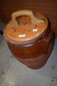 A vintage part glazed earthenware egg crock having wooden lid