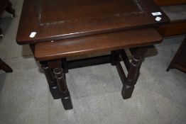 A mid Century part nest of two stained frame tables