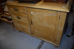 A Victorian stripped pine side cabinet, width approx 122cm