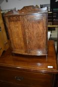 An Arts and Crafts oak smokers or medicine cabinet, width approx. 33cm