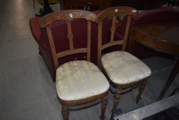 A pair of Victorian stripped salon chairs in the Aesthetic style