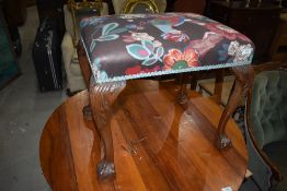 An early 20th Century dressing table stool having later upholstery
