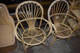 A pair of wicker work chairs