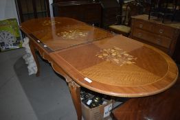 A reproduction Louis XV style dining table