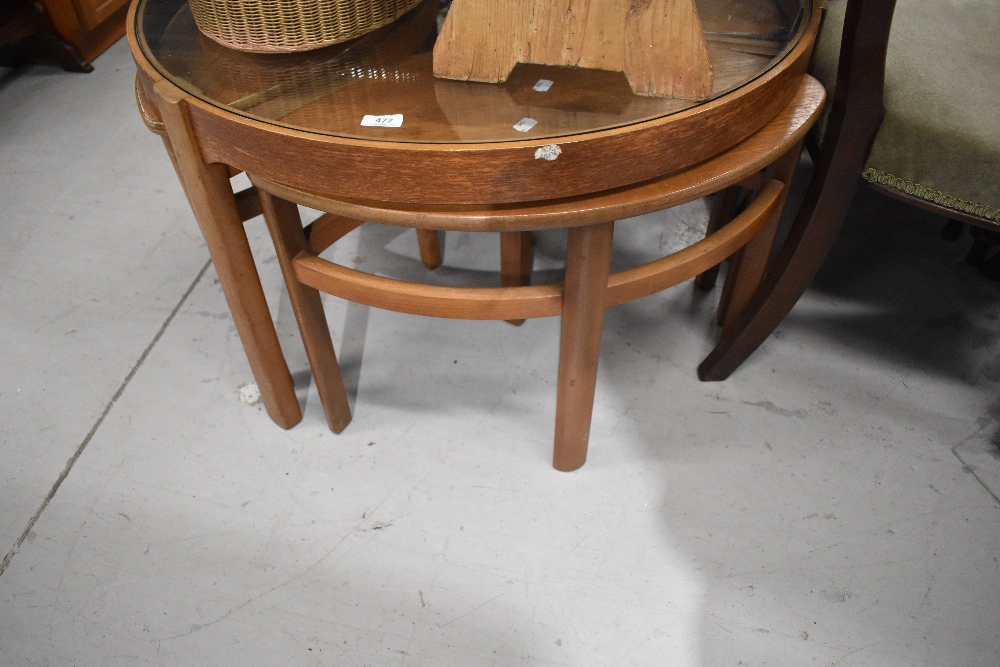 A vintage Nathan teardrop nest of tables