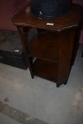 An early to mid 20th Century oak occasional table/bookshelf