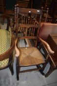 A 19th Century wool winder rocking chair having double spindle back and bobbin turned frame