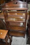 An Arts and Crafts oak bookshelf, stamped Reg number to reverse 510601