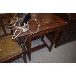 A vintage sewing machine table containing Jones machine