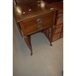 An early 20th Century mahogany and inlaid side table having drop flaps and two frieze drawers