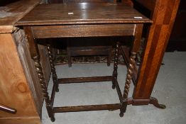 An early 20th Century oak twist leg side table