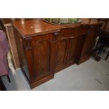 A Victorian mahogany sideboard having shaped front , width approx. 153cm