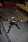 A 19th Century oak pedestal table having circular top, with protective glass, diameter approx. 80cm