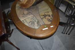 A vintage oval coffee table, oak and tile effect