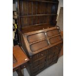 A mid 20th Century oak bureau bookcase in the Priory style