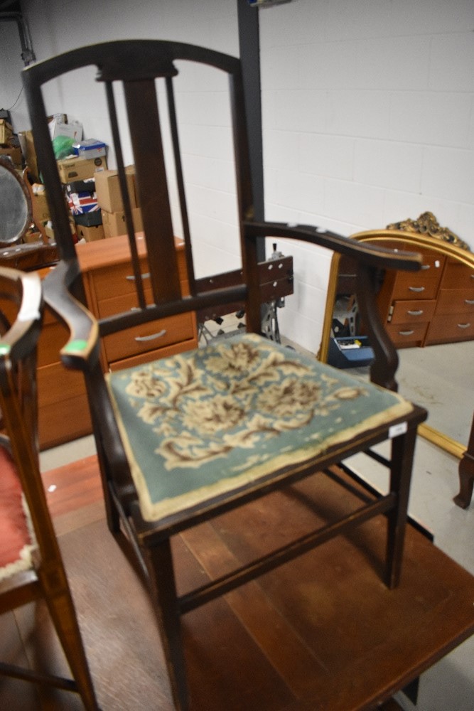 An Edwardian stained frame carver salon chair