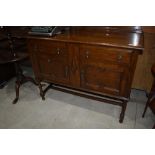 An early 20th Century oak sideboard having twist legs