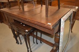 A mid 20th Century oak drawer leaf dining table