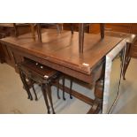 A mid 20th Century oak drawer leaf dining table