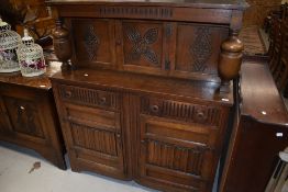 A mid to late 20th Century reproduction court cupboard , width approx. 120cm