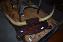 A mounted set of cattle horns, of small proportions, approx width 69cm