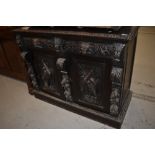 A 19th Century Oak sideboard base having three drawers with 'green man' style handles and phoenix