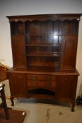 An Arts and Crafts oak dresser, having brass and copper details, width approx 153cm