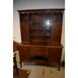 An Arts and Crafts oak dresser, having brass and copper details, width approx 153cm