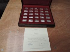 A set of John Pinches Elizabeth Our Queen 25 Silver Ingots in wooden presentation case with