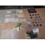 A collection of World Banknotes, Coins and Tokens including a small amount of Silver, a good