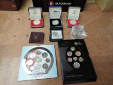 A small collection of GB Coins, Brilliant Uncirultaed 2000 Coin Set and Royal Shield of Arms Set