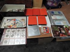 A collection of World Coins and Banknotes in albums an loose along with a 2014 Coin Year Book