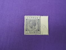 A George V 1924-1928 Cyprus mounted used £5 Black/Yellow (1928) Stamp, known forgeries in