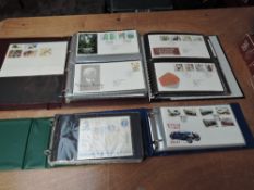 A collection of mainly GB & Jersey First Day Covers in four albums, 1990's onwards special