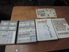 Three stock books and one album of World Stamps, mint & used, including mint GB