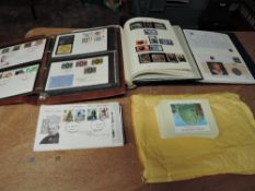 An album of GB Queen Elizabeth II stamps, an album containing three Coin Covers, an album and