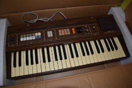 A vintage (1980s) Casio Tone CT-301 Synthesizer keyboard, in original box