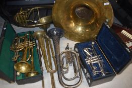 A large selection of brass instruments including Besson class A cornet