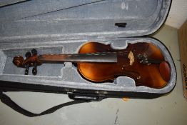 A composite violin, of traditional form, label to body inside made in Czechoslovakia, bridge stamped