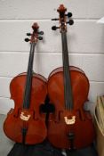 Two traditional student size cellos, in soft bags (1/4 size?)