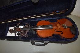 A traditional violin, having 2 piece back, approx 14in, labelled for M Couturieux, in modern case,